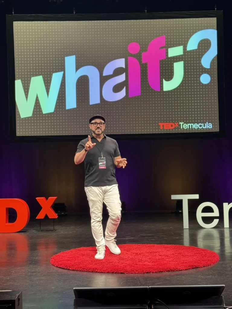 Dr. Hassan Bencheqroun on the red circle at TEDx Temecula 2026 delivering "My Doctor"