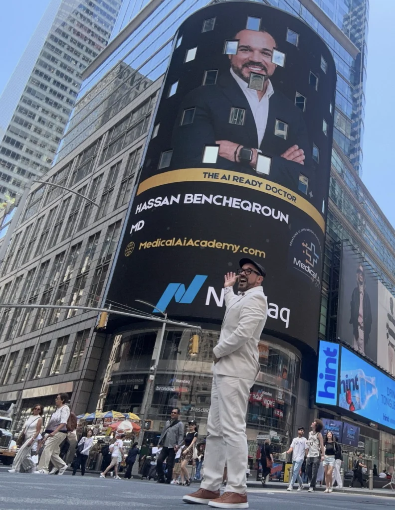 Dr. Hassan Bencheqroun in Times Square under the Nasdaq tower billboard featuring The AI Ready Doctor and Medical AI Academy